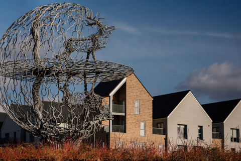 Globe outdoor structure with new build houses in the background