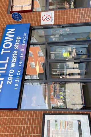 Shop front with a sign "Refill Town Zero Waste Shop"