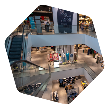Inside the John Lewis department store in Chelmsford showing 3 floors separated by escalators